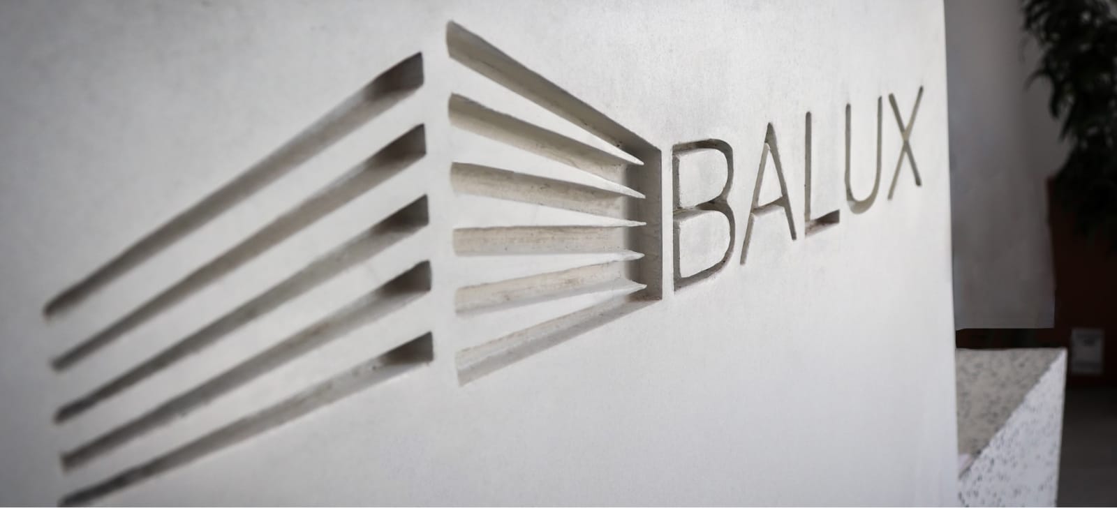 Balux logo embedded in concrete.