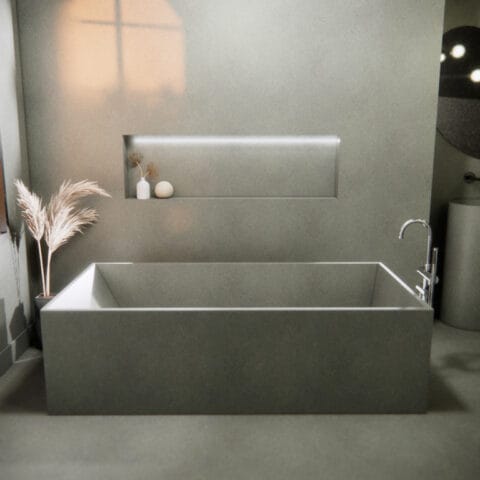 Baignoire et mur de beton.