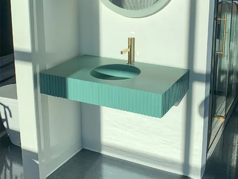 Vanite en beton modele ovo flute couleur aqua.